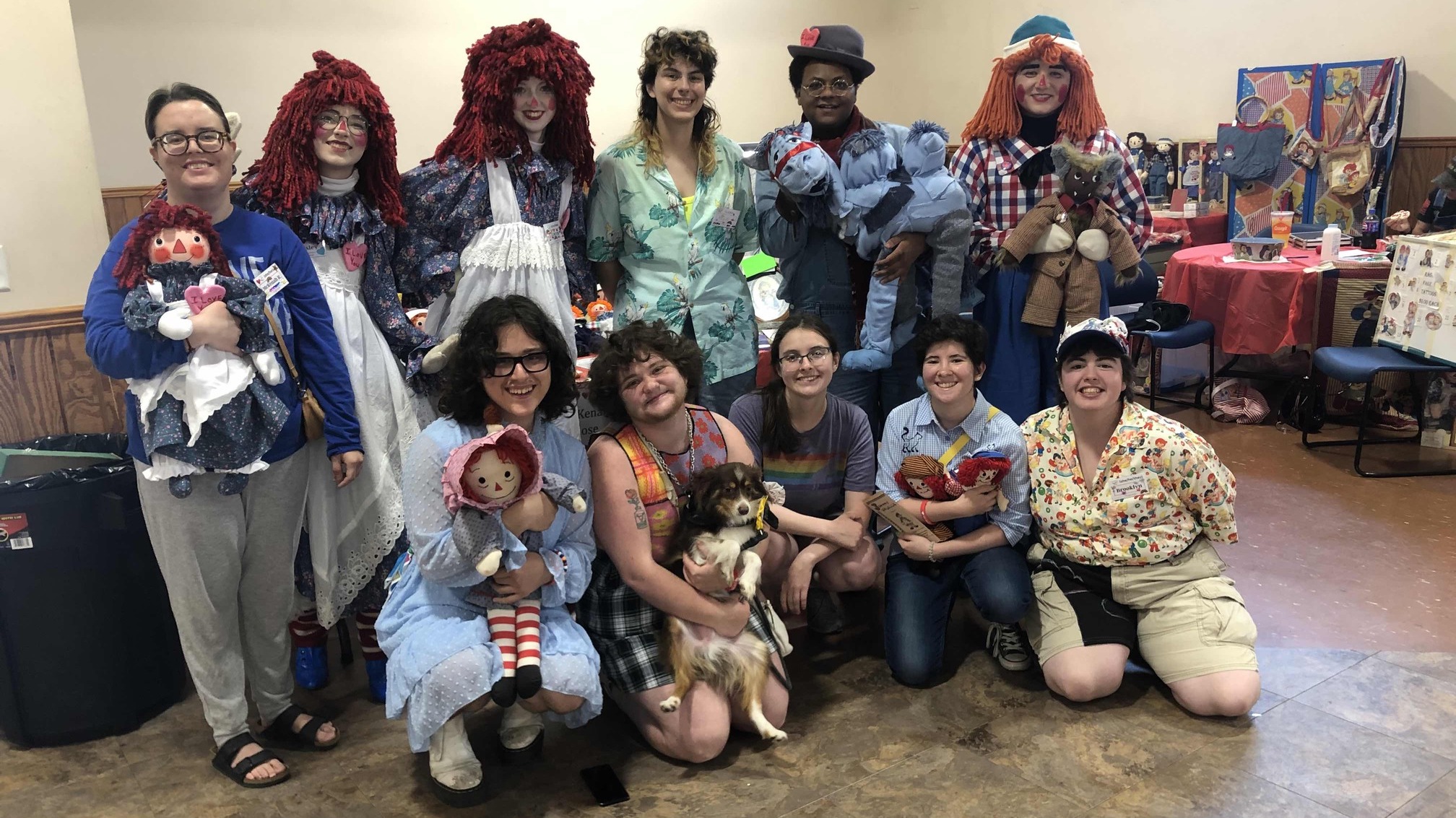 Eleven people posing for a group photo.